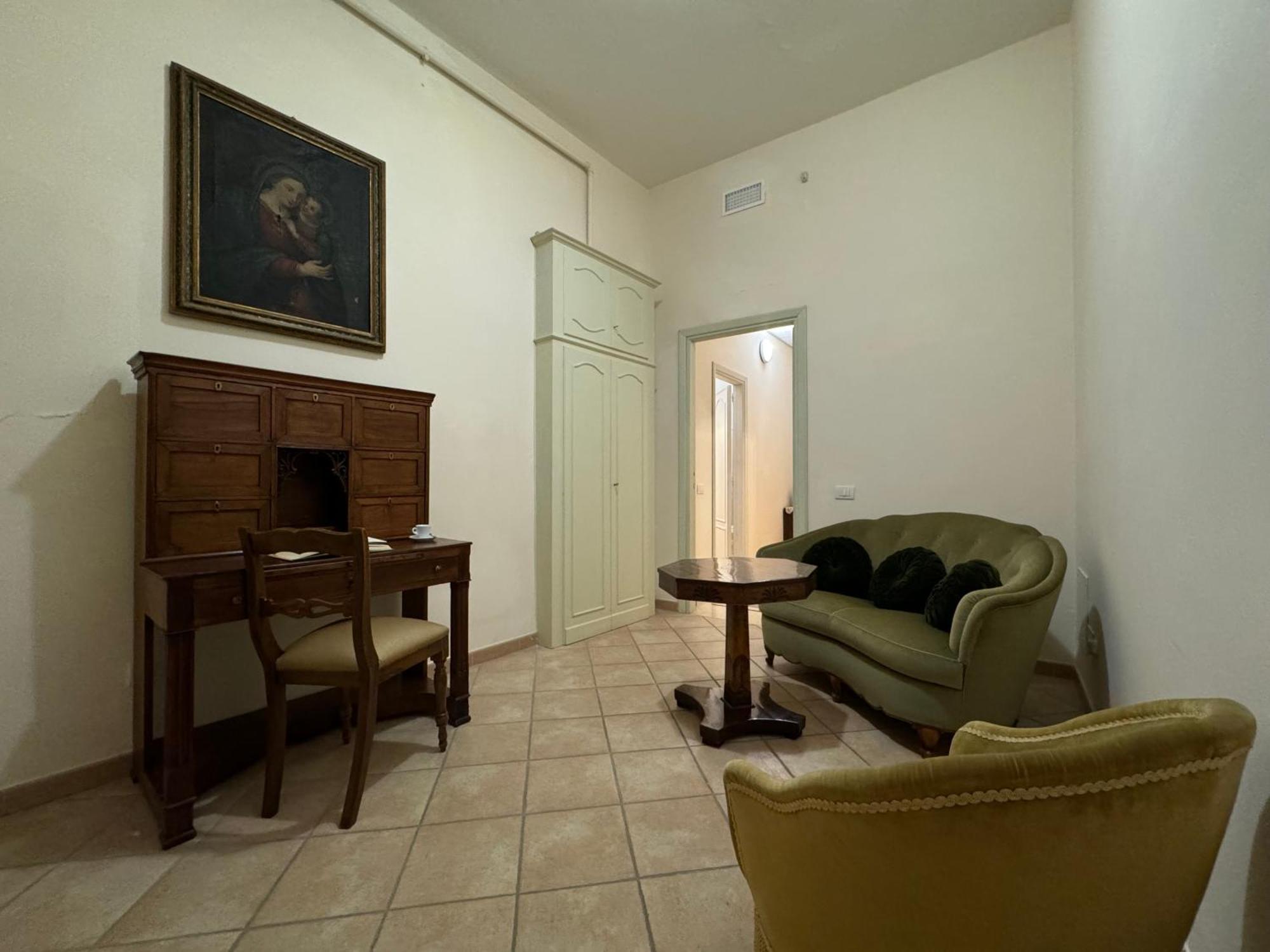 Monastero Ss. Annunziata Hotell Todi Exteriör bild The living room of the apartment